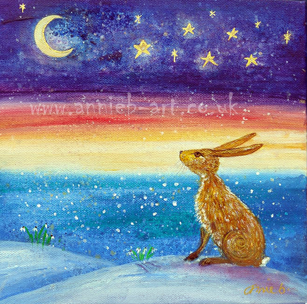A magical hare sits on a Cornish cliff under a New moon and starry sky as the snow gently falls over the ocean contemplating new beginnings...  