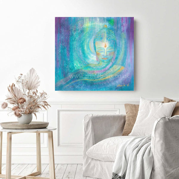 This serene painting by Cornish artist annie b. depicts a peaceful buddha sending out light, love and blessings of hope to the world.  A mixed medium painting on deep edge boxed canvas with a hint of sparkle and gold, ready for your walls to uplift any space in your home, workspace, yoga studio or meditation room