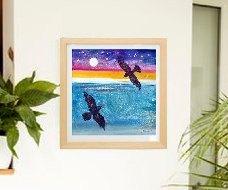  Two rare Cornish choughs with their red beaks flying over the turquoise ocean below a magical full moon and starry sky   Square format fine art print available with two options to choose from:  Print only option- image size 36cm x 36cm plus 2cm white border, hand titled and signed by artist   Print mounted signed and framed with natural wooden frame – Framed size is 50.8cm x 50.8cm/ 20”x 20”  