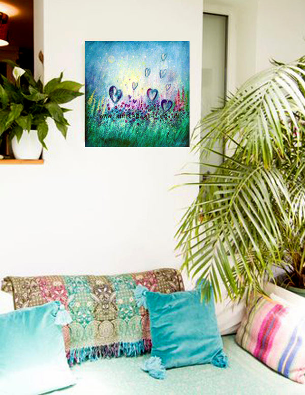 'Love each moment as the flowers love the sunshine' is an original  painting by annie b. mixed medium on deep edge boxed canvas with a hint of sparkle and iridescent paint.  Fox gloves, poppies, and lots of wild flowers reach up to the sunshine in the  azure blue sky above sending out their love as hearts float gently to the sky.. where love grows a painting depicting all the love of mother earth and reminding us to be mindful of the love in every moment.